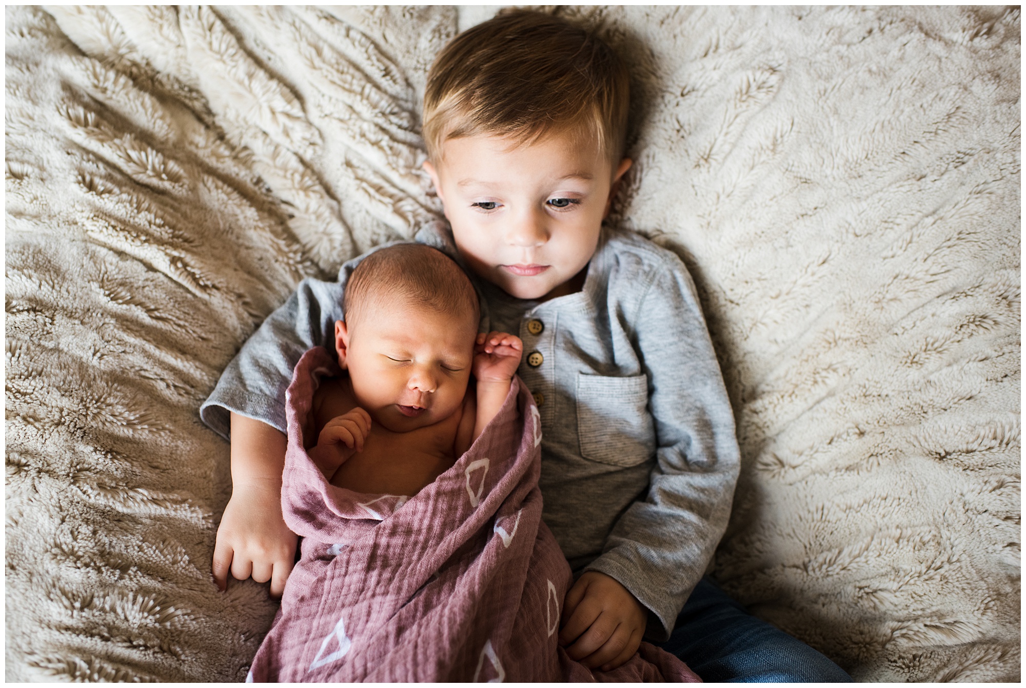 Big brother with newborn baby sister